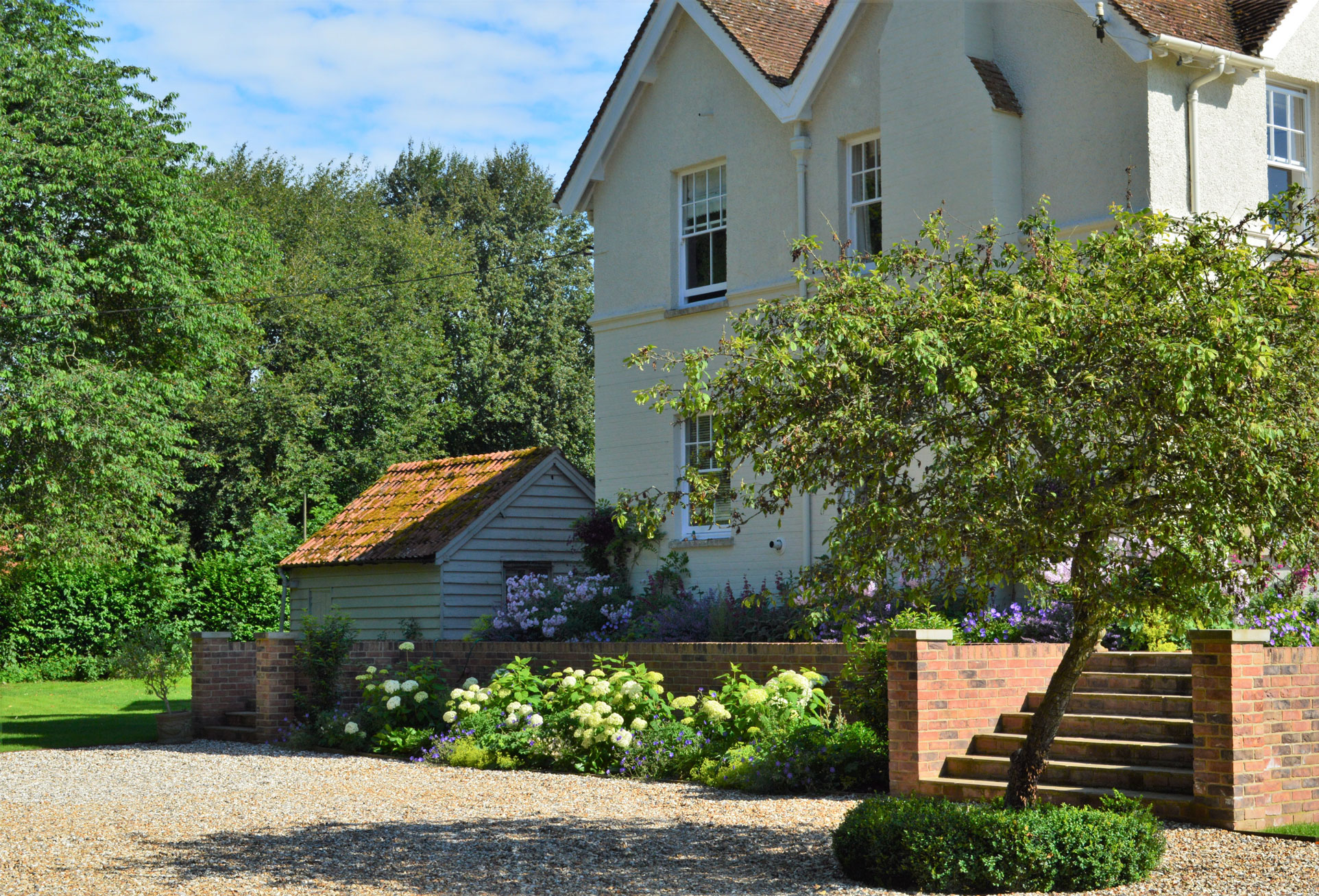 Country house garden design with Hydrangea 'Annabelle'